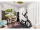 Bright sunroom with large windows, an exercise machine, and a cozy workspace at 1919 Edinburgh Ne Ter, Atlanta, GA 30307