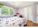 Bright bedroom offers hardwood floors, large window and a closet at 2920 Appling Dr, Atlanta, GA 30341