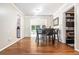 Bright dining room with hardwood flooring, adjacent to sunroom, and easy access to kitchen at 2920 Appling Dr, Atlanta, GA 30341