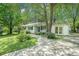 A well maintained ranch-style home with fresh landscaping and a curved walkway at 2920 Appling Dr, Atlanta, GA 30341