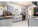 Efficient kitchen with ample countertop space, appliances, and black and white tile floor at 2920 Appling Dr, Atlanta, GA 30341