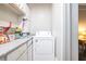 Utility room featuring a washing machine and minimal counter space for folding at 2920 Appling Dr, Atlanta, GA 30341