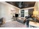 Living room featuring unique black ceiling, exposed brick wall, and wood burning stove at 2920 Appling Dr, Atlanta, GA 30341