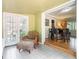 Bright sunroom, leads to dining room, provides natural light, and has a relaxing atmosphere at 2920 Appling Dr, Atlanta, GA 30341