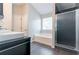 Bathroom showcasing a soaking tub, and a walk-in shower at 6757 Delaware Bnd, Fairburn, GA 30213