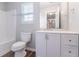 Bright bathroom featuring a modern vanity with white cabinets and a spacious shower/tub combo at 6757 Delaware Bnd, Fairburn, GA 30213