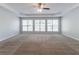 Expansive bedroom offers a large window array, plenty of sunlight, and ample space at 6757 Delaware Bnd, Fairburn, GA 30213