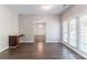 Bright dining room with hardwood floors, neutral walls, and sliding glass doors for indoor/outdoor living at 6757 Delaware Bnd, Fairburn, GA 30213