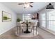 Cozy dining area features carpet, a breakfast bar, and kitchen view at 6757 Delaware Bnd, Fairburn, GA 30213