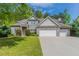 Charming two-story brick home with a well-manicured lawn, three-car garage, and tasteful landscaping at 6757 Delaware Bnd, Fairburn, GA 30213