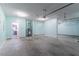 Spacious two car garage featuring a clean concrete floor and plenty of storage space at 6757 Delaware Bnd, Fairburn, GA 30213