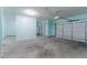Spacious two car garage featuring a clean concrete floor and plenty of storage space at 6757 Delaware Bnd, Fairburn, GA 30213