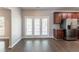 Modern kitchen featuring stainless steel appliances, dark wood cabinets, and sliding glass doors at 6757 Delaware Bnd, Fairburn, GA 30213
