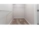 A well-lit walk-in closet with shelving at 6757 Delaware Bnd, Fairburn, GA 30213