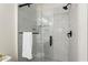 Modern bathroom featuring glass enclosed shower, marble tiling, and black hardware at 821 Ralph Mcgill Ne Blvd # 2412, Atlanta, GA 30306