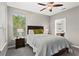 Bright bedroom features a ceiling fan, neutral walls, and carpet flooring at 821 Ralph Mcgill Ne Blvd # 2412, Atlanta, GA 30306