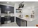 Modern kitchen with stainless steel appliances, dark cabinetry, and white quartz countertops at 821 Ralph Mcgill Ne Blvd # 2412, Atlanta, GA 30306