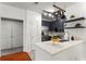 Modern kitchen featuring stainless steel appliances, gray cabinetry, pot rack, and white quartz countertops at 821 Ralph Mcgill Ne Blvd # 2412, Atlanta, GA 30306