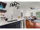 Modern kitchen with stainless steel appliances, quartz countertops, and an open view of the living room at 821 Ralph Mcgill Ne Blvd # 2412, Atlanta, GA 30306