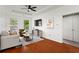 Bright living room with hardwood floors, white walls, large windows and a ceiling fan at 821 Ralph Mcgill Ne Blvd # 2412, Atlanta, GA 30306