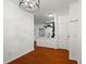 Open concept living space with hardwood floors leading to kitchen area and coat closet at 821 Ralph Mcgill Ne Blvd # 2412, Atlanta, GA 30306