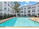 Resort-style pool area with lounge chairs and a modern fountain feature, perfect for relaxation and summer fun at 821 Ralph Mcgill Ne Blvd # 2412, Atlanta, GA 30306