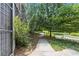 Community walkway surrounded by lush trees and green landscape at 821 Ralph Mcgill Ne Blvd # 2412, Atlanta, GA 30306