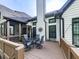 Beautiful back deck with seating area, wood railing, and view of the backyard at 1076 Pinyan Ln, Canton, GA 30115