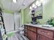 This bathroom features a single sink vanity, a toilet, and a tiled shower at 1076 Pinyan Ln, Canton, GA 30115