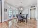 Charming breakfast nook with hardwood floors, a chandelier, and outdoor access at 1076 Pinyan Ln, Canton, GA 30115