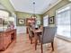 Bright dining room with hardwood floors, ample natural light, and classic decor at 1076 Pinyan Ln, Canton, GA 30115