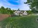 Beautiful home exterior with a well-kept lawn and mature trees at 1076 Pinyan Ln, Canton, GA 30115