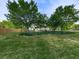 Beautifully landscaped front yard leading up to a lovely home with mature trees at 1076 Pinyan Ln, Canton, GA 30115