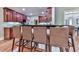 The kitchen bar boasts plenty of seating, hardwood floors, and ample cabinet space at 1076 Pinyan Ln, Canton, GA 30115