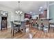 Eat-in kitchen featuring a breakfast bar with seating, hardwood floors, and great light at 1076 Pinyan Ln, Canton, GA 30115