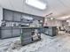 This modern kitchen features sleek gray cabinets, a kitchen island and stainless steel appliances at 1076 Pinyan Ln, Canton, GA 30115