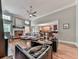 The living room features hardwood floors, stone fireplace, and large windows at 1076 Pinyan Ln, Canton, GA 30115