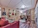 This is a living room with hardwood floors, a couch, and musical instruments on the wall at 1076 Pinyan Ln, Canton, GA 30115