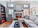 Spacious living room with fireplace, hardwood floors, and plenty of natural light at 1076 Pinyan Ln, Canton, GA 30115