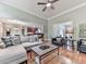 Open-concept living room with hardwood floors and easy access to the kitchen at 1076 Pinyan Ln, Canton, GA 30115