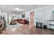 This living room features hardwood floors, and an opening to another room at 1076 Pinyan Ln, Canton, GA 30115