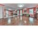This is a recreation room with hardwood floors, mirrors on the wall and doors at 1076 Pinyan Ln, Canton, GA 30115