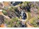 Aerial view of a beautiful home nestled amidst lush greenery, showcasing the property's serene setting at 2009 Pine Forest Ct, Jonesboro, GA 30236
