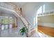 Spacious foyer with high ceilings, featuring a staircase and access to multiple rooms at 2009 Pine Forest Ct, Jonesboro, GA 30236