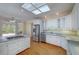 Open kitchen featuring white cabinets, stainless steel appliances, and a central island at 2009 Pine Forest Ct, Jonesboro, GA 30236