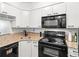 Modern kitchen features white cabinets, granite countertops, and stainless steel appliances at 2870 Pharr Court S Nw # 1608, Atlanta, GA 30305