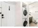 Convenient laundry area with stackable washer and dryer, next to the front door at 2870 Pharr Court S Nw # 1608, Atlanta, GA 30305