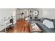 Spacious living area with hardwood floors, workspace, neutral sofa, and ample natural light at 2870 Pharr Court S Nw # 1608, Atlanta, GA 30305