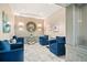 Inviting lobby with plush blue chairs, elegant marble floors, and decorative wall art at 2870 Pharr Court S Nw # 1608, Atlanta, GA 30305