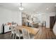 Spacious kitchen with stainless steel appliances, pendant lights and modern island at 3130 Bennett Creek Ln, Suwanee, GA 30024